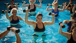 aqua aerobics exercise with dumbbells pool