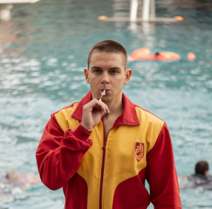 full shot lifeguard blowing whistle 1