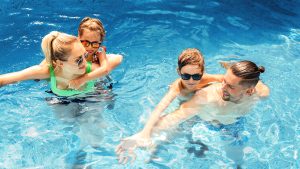Happy family in the pool